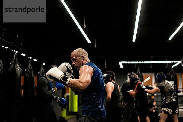 Boxers fighting in boxing training in the gym.