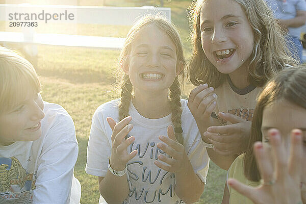 Girls enjoying maple sugar cotton candy at the Fryeburg Fair in Maine.