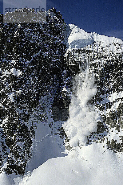 Avalanche falling down Mount Neacola  Lake Clark National Park  Alaska.