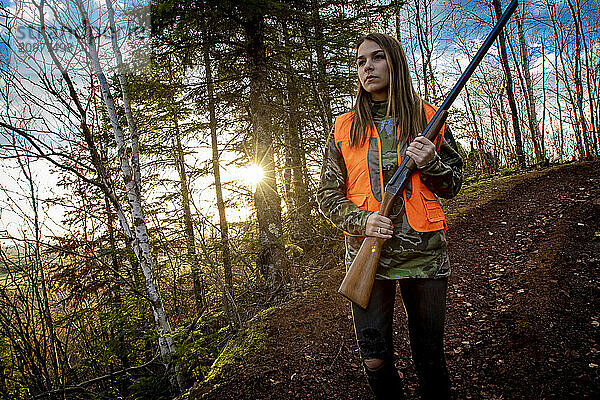 Portrait of young woman out hunting  Biwabik  Minnesota  USA