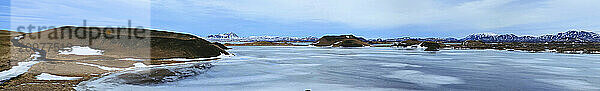 Frozen Myvatn Lake  among Skutustadirgigar pseudo-craters  Iceland