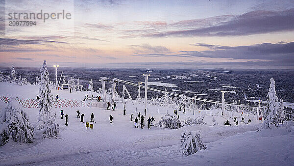 People skiing in the winter ski resort of Iso Syote  Lapland  Finland