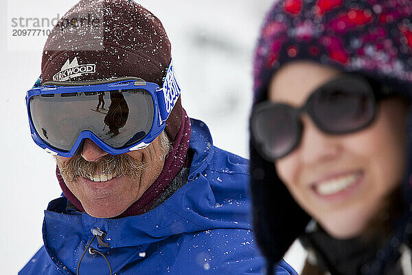 Skiiers enjoy the day at a ski resort in California.