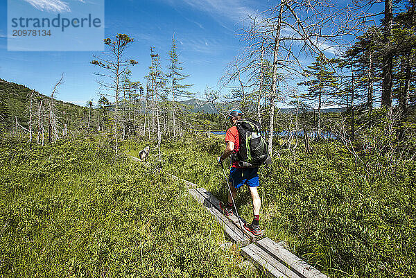 Hiker on his way up to Cannon Mountain from Lonesome Lake.