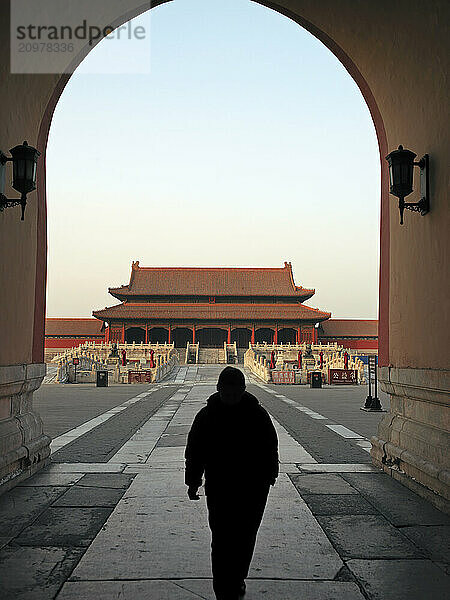 Silhouette of man in archway