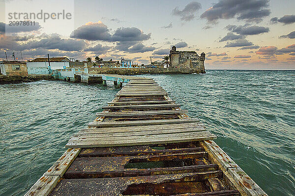 Old wharf in sea and castle  Havana  Cuba