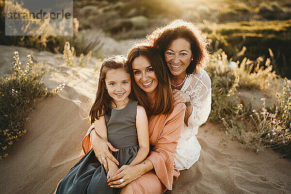 Portrait three generations women mom grandma girl beach sunset Spain