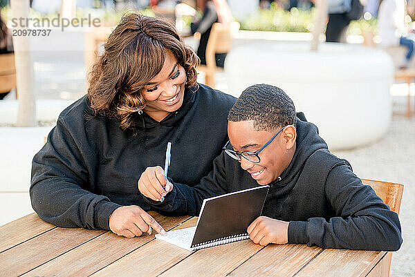 Adult helping child with homework