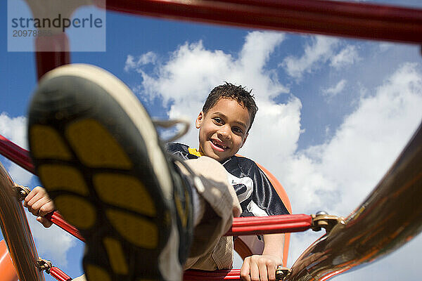 Young boy playing in playground in Sacramento  CA.