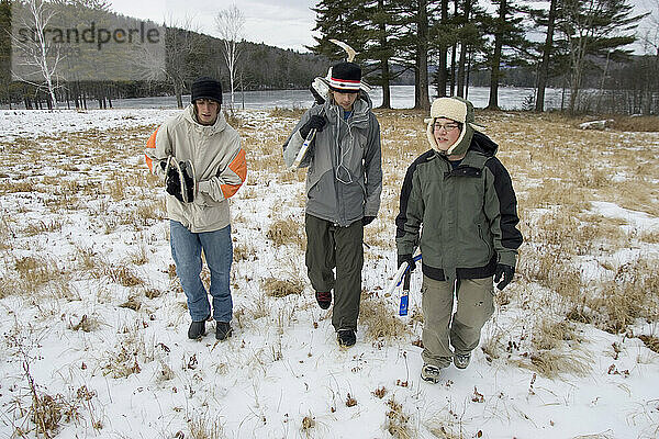 Young men returning from Ice Hockey  New England  USA