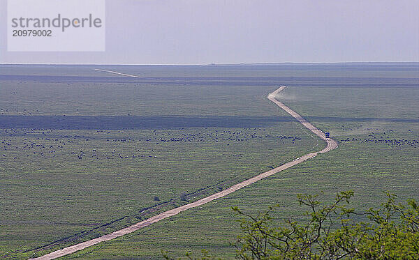 Main road through the Serengeti plains  with traffic