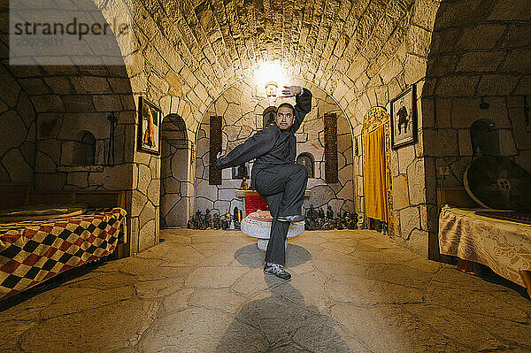 Shaolin Monk Shi De Jian demonstrates traditional martial arts at the San Huang Zhai Monastery on the Song Mountain  China.