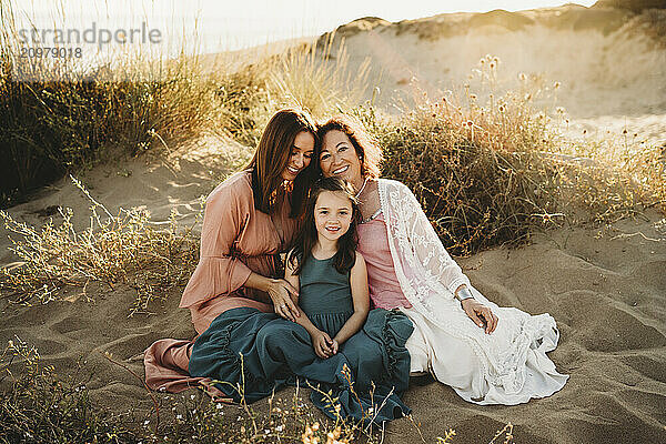 Three generations of women at beach on summer day