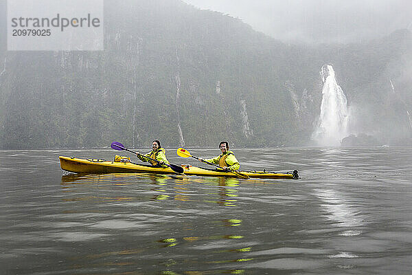 kayakers in Millford Sound  New Zealand