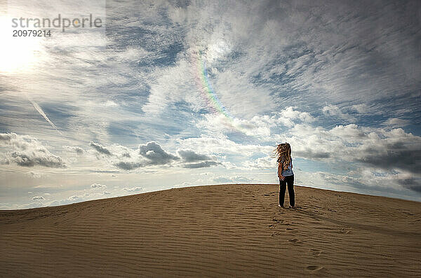 Young girl standing on top of Jockey's Ridge sand dune