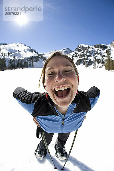 Young woman snowshoeing near Lake Tahoe  California.