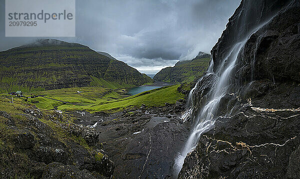 Hillside waterfall  Saksun Church  Faroe Islands