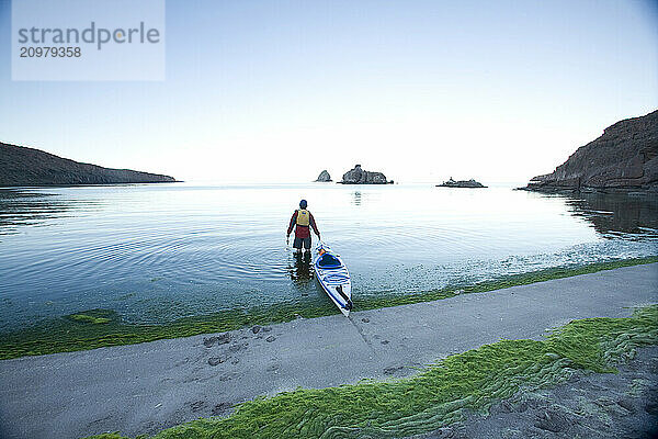 Young male kayaker at twilight on the Sea of Cortez  Mexico