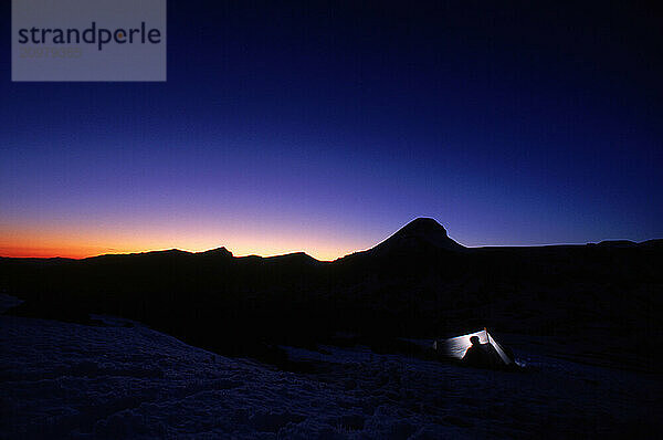 Backcountry patrol  camping illuminated night twilight