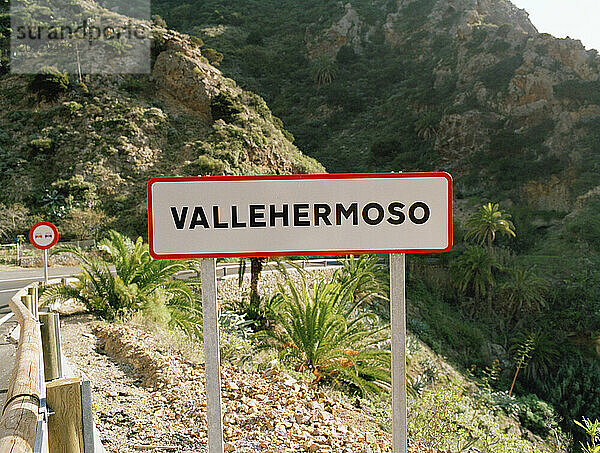 A sign on the road in Spanish that says Vallehermoso  which translates to 'beautiful valley' in English.Vallehermoso is located on the southwestern and the northwestern coasts