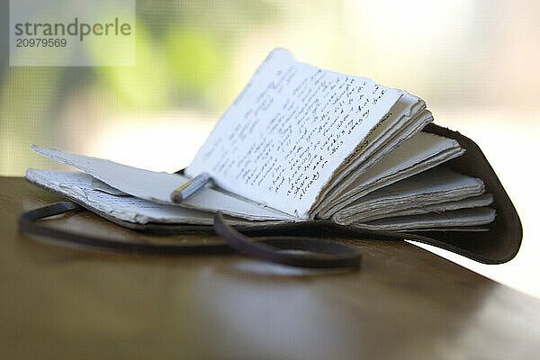 Still life of journal and pencil.