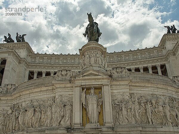 View of a monument decorated with sculptures in Rome under a cloudy sky  rome  italy