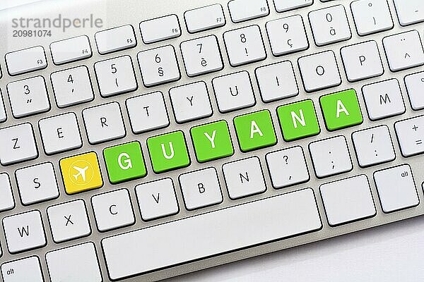 GUYANA writing on white keyboard with a aircraft sketch