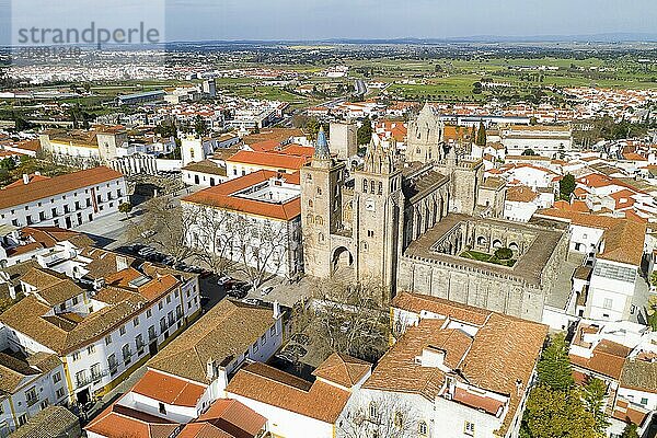 Evora drone aerial view on a sunny day with historic buildings city center and church in Alentejo  Portugal  Europe