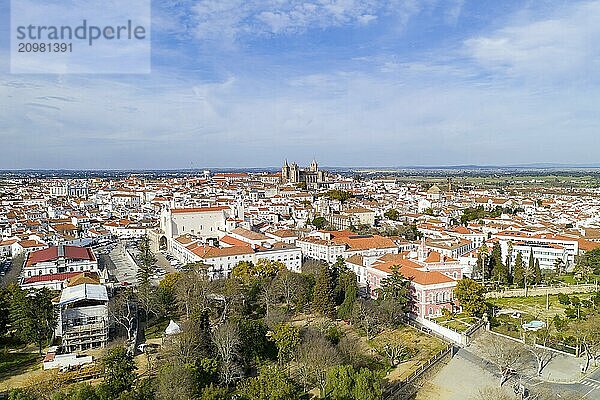 Evora drone aerial view on a sunny day with historic buildings city center and church in Alentejo  Portugal  Europe