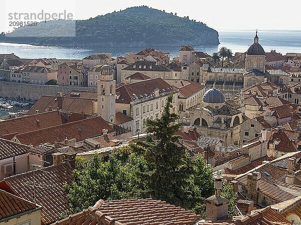 Overview of a city with red tiled roofs  an island in the background and the sea  dubrovnik  Mediterranean Sea  Croatia  Europe