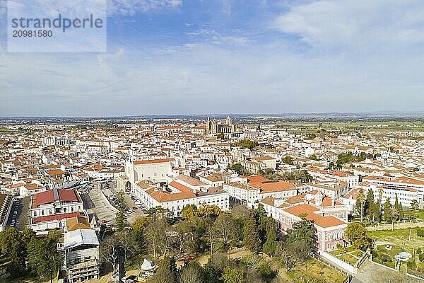 Evora drone aerial view on a sunny day with historic buildings city center and church in Alentejo  Portugal  Europe