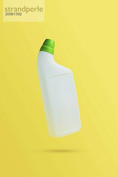 Levitating or flying blank toilet cleaner bottle with green cap. Isolated on yellow background. White plastic packaging. Household chemistry. Front  side view. Falling single object in air with shadow