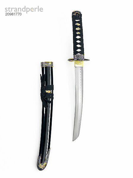 Japanese Tanto knife short sword and a scabbard isolated on white background