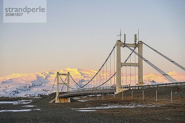 Beautiful sunrise view of Jokulsarlon ice lake bridge at night in winter. Iceland