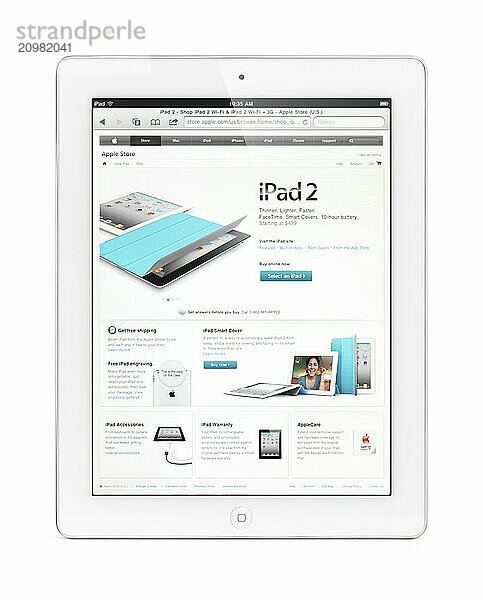 IPad 2 tablet computer with Apple online store on its display. Isolated with clipping path on white background