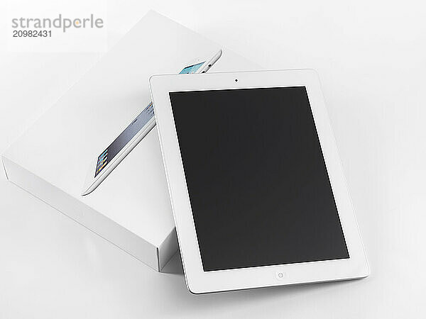 New Apple iPad 2 just out of the box. Isolated on white background