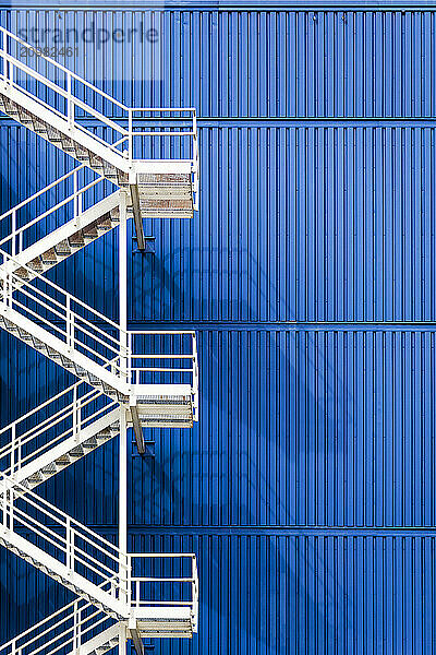 White emergency staircase with blue background