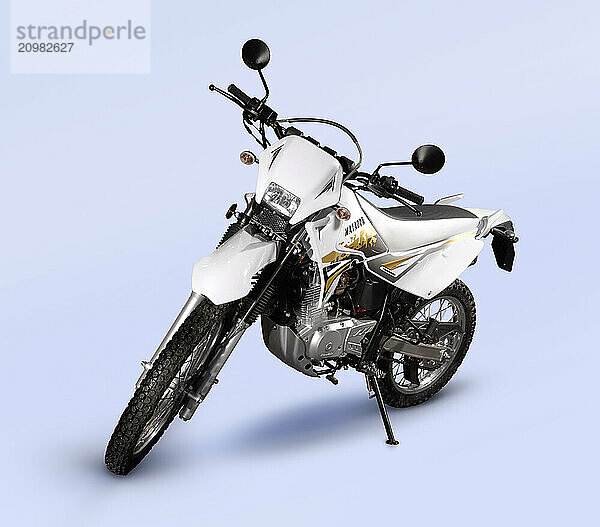 Stock photo of QingQi QM200GY Matador Light On Off Road Bike Isolated motorcycle with a clipping path on light blue background