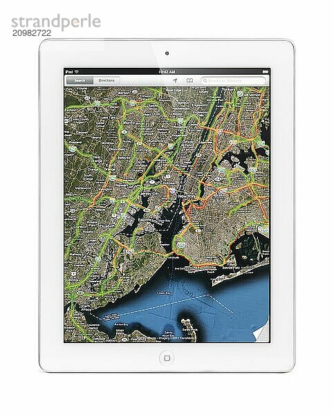 Apple iPad 2 tablet computer displaying a map of New York with traffic by Google Maps on its screen. Isolated with clipping path on white background