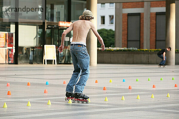 Inline skaters on a parkour in the city centre  Cologne  North Rhine-Westphalia  Germany  Europe