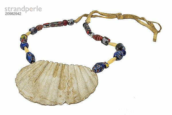 Native American necklace with a large seashell and old glass beads on a leather cord  set free on white