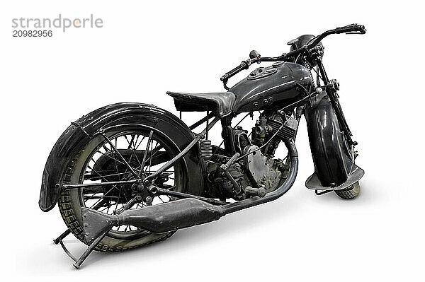 Old isolated black motorcycle World War Two period isolated on white