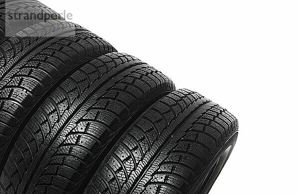 Set of four winter tires isolated on white background