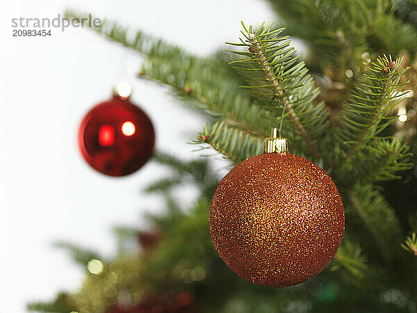 Colorful ornament on a Christmas tree isolated on white background