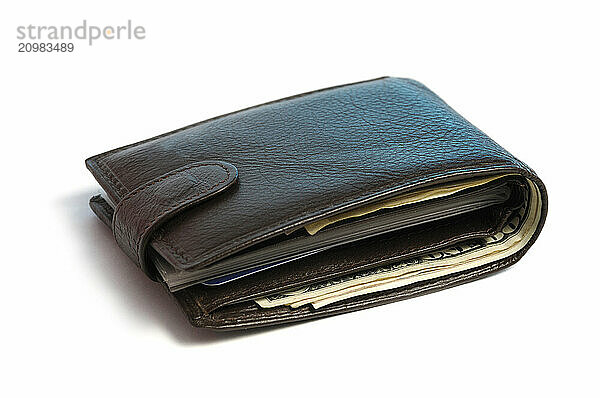 Brown leather wallet with US dollar bills in it Isolated on white