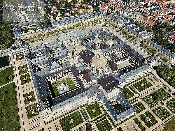 Large historic monastery with several courtyards  surrounded by parks and a town  aerial view  Real Sitio de San Lorenzo de El Escorial  Royal Seat of St Lawrence of El Escorial  palace and monastery complex  San Lorenzo de El Escorial  Madrid  Spain  UNESCO World Heritage Site  Europe