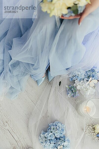 Sky blue shoes and dress of the bride at a wedding photo shoot.