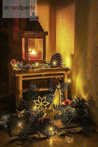 Christmas decoration with candles  fir branches  Father Christmas and glass baubles against a dark background