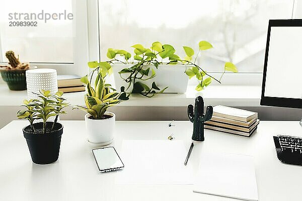 Smartphone on white table  work from home  office stuff.