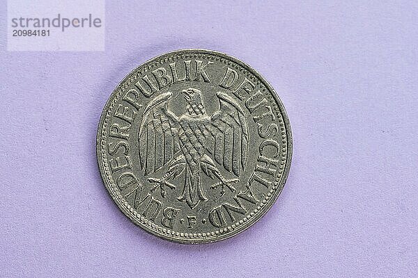 One german Mark coin marked Bundesrepublik Deutschland from 1968 on purple background